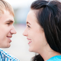 Portrait of a beautiful young happy smiling couple