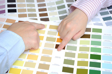 Business people with swatches to decide the color of the office