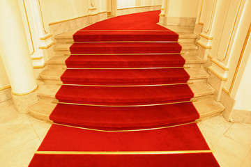 Stairs covered with red carpet