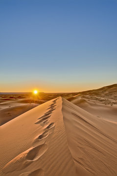 Sun rises over Erg Chebbi at Morocco