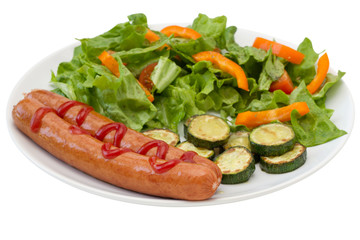 fried sausages with salad and vegetables
