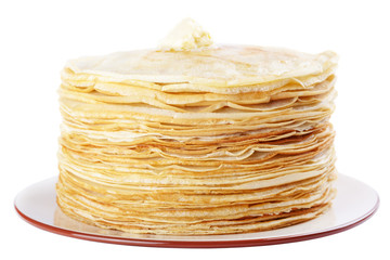 A stack of thin pancakes with butter