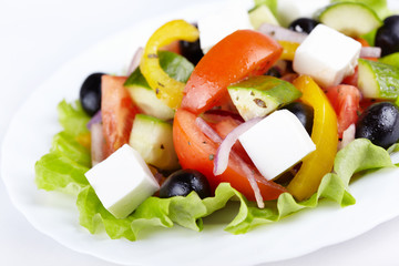 Greek salad on white plate