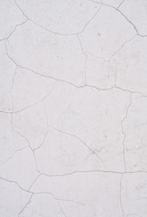 cracked painted white cement wall