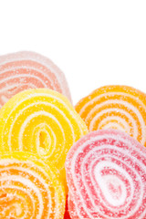 Delicious colorful candies pile. Close up on white