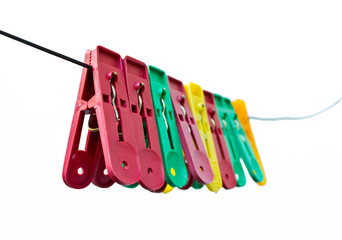 Colorful clothes pegs hanging