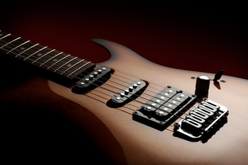 Fototapeta na wymiar close up of a electric guitar on dark background