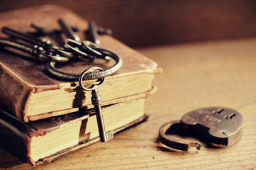 old keys on a old book, antique wood background