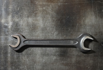 wrench on metal background