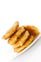 fried fritters on a white plate