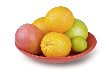 tropical fruit in a bowl isolated on white