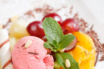 tasty dessert with ice cream and fruits