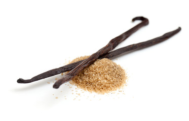 vanilla beans and brown vanilla sugar isolated on white backgrou