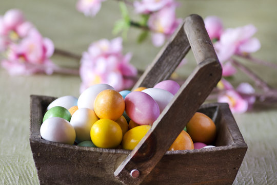 easter colorful eggs on wooden basket