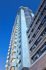 Obraz premium Modern skyscraper on blue sky background in Samara, Russia
