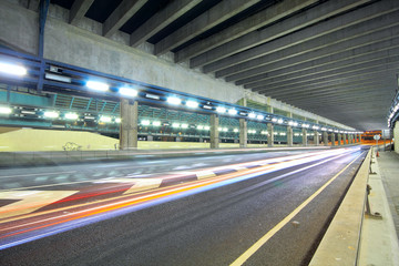 Traffic at night with traces of lights left by the cars on a hig