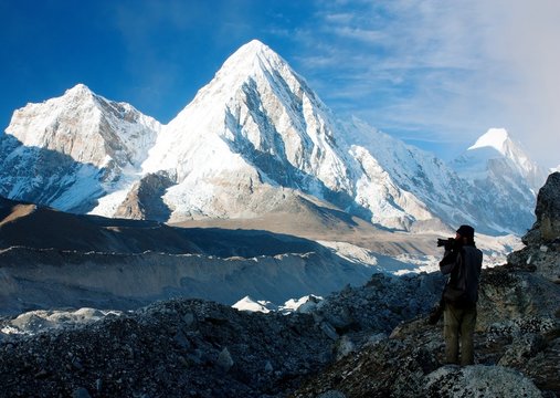 photographer on mountains - hiking in Nepal