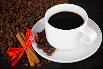 Coffee cup and crops on bamboo coaster