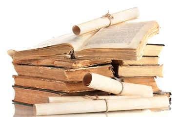 Pile of old books and scroll isolated on white