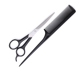 Hair cutting shears and comb isolated on white