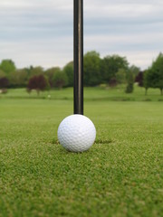 ball beside the hole