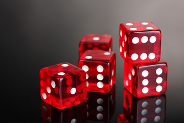 Red dices on grey background