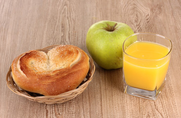 Classical breakfast. Orange juice and bun