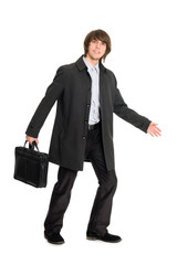 young business man in a raincoat