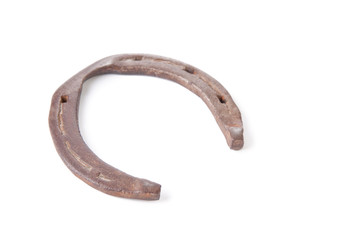 Old rusty horseshoe, isolated over white, copyspace