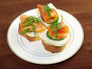 Canapes with smoked salmon  cheese and cucumber