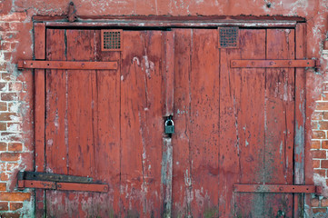 Fototapeta na wymiar old red wooden gate