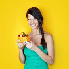 young woman with fresh strawberries in a basket