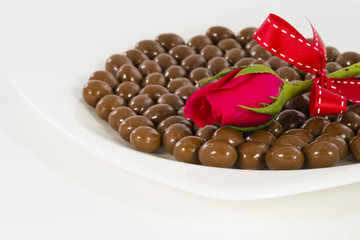 Chocolate heart and rose in the Valentine's Day