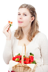 Woman eating fresh strawberries