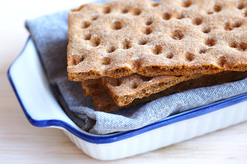 Wafers of swedish dry rye crisp bread, cracker in a bread plate