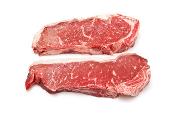 Sirloin steaks (beef) isolated on a white studio background.