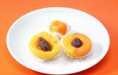 Fototapeta na wymiar Fruit candy peach, apricot, sweet cherry