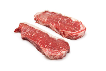 Sirloin steaks (beef) on a white studio background.