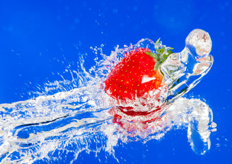 Fresh strawberry in water splash