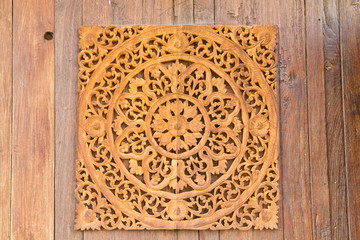 Pattern of flower carved on wood background
