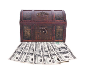 Wooden chest with money isolated on white