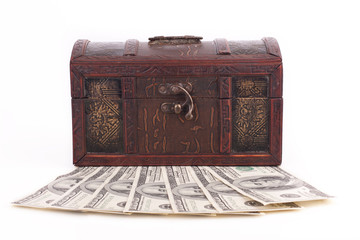 Wooden chest with money isolated on white background