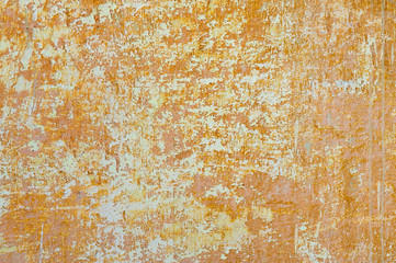 Grungy background. Old scratched orange wall.