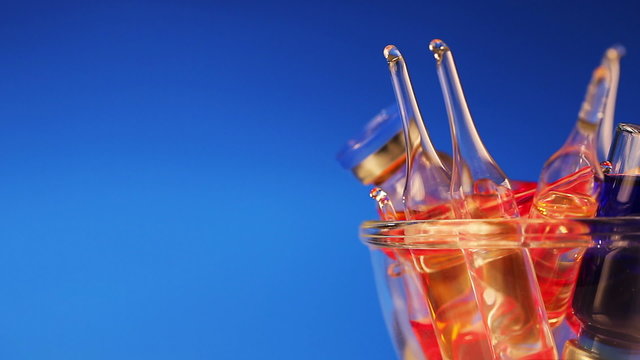 Health care / medical concept: many vivid ampoule rotating
