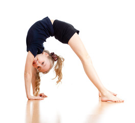 young girl doing gymnastics over white background
