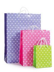 Bright gift bags isolated on white