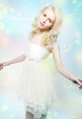 Obraz na płótnie Canvas Beauty - attractive gentle blonde girl in white dress