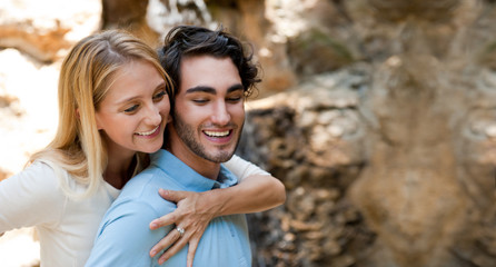 Obraz premium Portrait of love couple embracing outdoor in park
