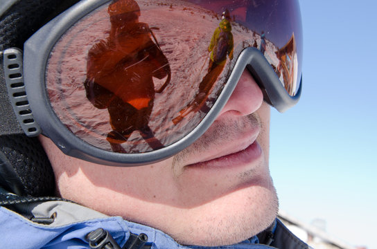 Male skier wearing ski glasses