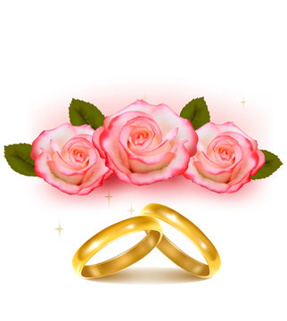 Gold wedding rings in front of three pink roses